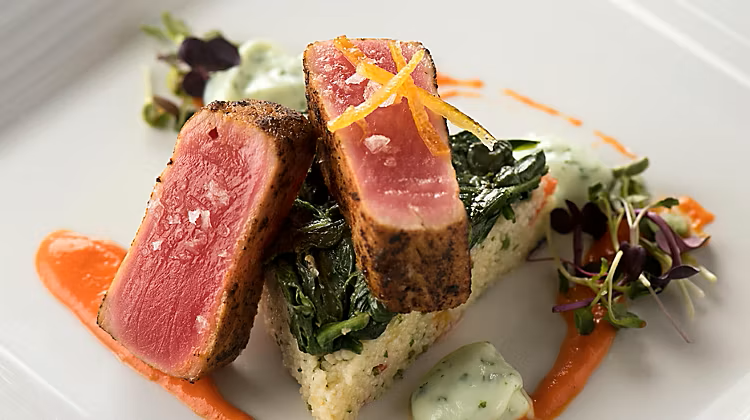 A plated seared tuna dish served in the main dining room