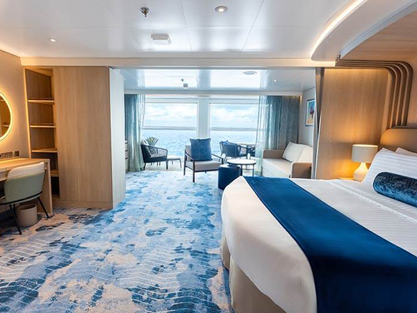 A Star of the Seas stateroom with a balcony over the Caribbean Sea