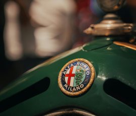 Europe Close-up of a vintage Alfa Romeo car emblem, capturing nostalgic retro details.